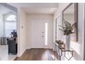 Bright entryway with hardwood floors and a decorative console table at 7749 Brookway St, Orlando, FL 32817