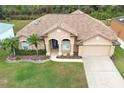 One-story house with brown roof, landscaping, and driveway at 11537 Blackmoor Dr, Orlando, FL 32837