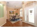 Dining room with wood floors, ceiling fan, and a table with chairs at 11537 Blackmoor Dr, Orlando, FL 32837