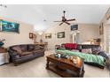 Spacious living room with leather sofas and wood flooring at 1220 Alden Ter, Deltona, FL 32738