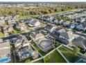 Neighborhood aerial showcasing the pool, fenced in yard, and well-maintained landscaping at 14190 Dove Hollow Dr, Orlando, FL 32824