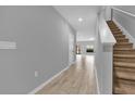 Bright and airy entryway with tile floors and staircase at 232 Rustic Loop, Sanford, FL 32771