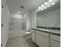 Bathroom with granite countertop and bathtub at 3265 Vesara Dr, Davenport, FL 33837