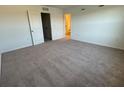 Spacious bedroom with plush carpeting and ensuite bathroom at 3265 Vesara Dr, Davenport, FL 33837