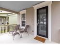 Inviting front porch with comfortable seating and view of the street at 3721 Cleary Way, Orlando, FL 32828