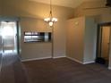 Dining room with a chandelier, neutral walls, and carpeting at 4709 Capri Pl # 189, Orlando, FL 32811