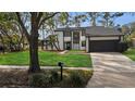 Contemporary two-story home, freshly painted with a landscaped yard at 4940 Spring Run Ave, Orlando, FL 32819