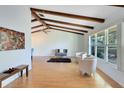 Light-filled living area with hardwood floors and wood beams at 846 Leopard Trl, Winter Springs, FL 32708