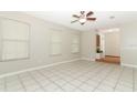 Bright living room with tile floors and a ceiling fan at 102 Carriage Hill Dr, Casselberry, FL 32707