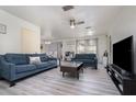 Bright living room featuring hardwood floors and ample seating at 1074 Gerona Ave, Deltona, FL 32725