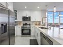 Updated kitchen featuring stainless steel appliances at 13427 Blue Heron Beach Dr # 1001, Orlando, FL 32821