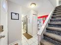 View of entryway with kitchen and staircase at 1350 Winter Green Way, Winter Garden, FL 34787