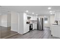 Modern kitchen with stainless steel appliances and white cabinets at 1703 E Fern Rd, Lakeland, FL 33801