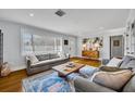 Living room featuring hardwood floors and a large window at 2127 Lake Dr, Winter Park, FL 32789