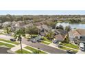 Aerial view of a residential neighborhood near a lake at 2760 Curpin Ln, Orlando, FL 32825