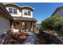 House entrance with brick columns and a walkway leading to the front door at 3511 Exeter Ct, Orlando, FL 32812