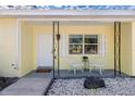 Inviting front porch with white chairs and landscaping at 3710 Sutton Dr, Orlando, FL 32810