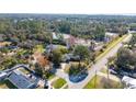 Home's aerial view showcasing its location near a road and body of water at 501 S Lacy Cir, Deltona, FL 32725