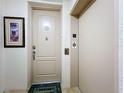 Condo building hallway with elevator and private entrance at 910 Lotus Vista Dr # 201, Altamonte Springs, FL 32714