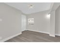 Bright bedroom featuring wood-look floors and neutral walls at 923 Ferndell Rd, Orlando, FL 32808