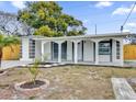 Charming house with a covered porch and well-maintained lawn at 923 Ferndell Rd, Orlando, FL 32808