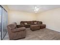 Living room with brown sectional sofa and tile floor at 95 Moonstone Ct, Port Orange, FL 32129