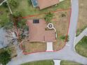 House with brown roof and swimming pool, seen from above at 10537 Versailles Blvd, Clermont, FL 34711