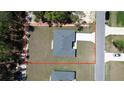 Aerial view of a property, including the building, driveway, and surrounding area at 13188 Sw Sw 65Th Cir, Ocala, FL 34473