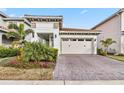 Well-maintained home with a two-car garage and landscaped yard at 13567 Abberwick Dr, Orlando, FL 32832