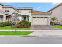 Attractive home with landscaping and a two-car garage at 13567 Abberwick Dr, Orlando, FL 32832
