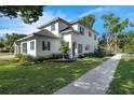 Charming home featuring lush landscaping and a well-maintained lawn on a sunny day at 500 W Hazel St, Orlando, FL 32804