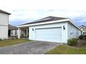 Attached garage with solar panels on the roof at 6554 Rover Way, St Cloud, FL 34771