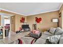 Living room features gray couch, TV, and decorative rug at 122 Water Front Way # 370, Altamonte Springs, FL 32701