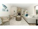Spacious living room featuring a stone fireplace and hardwood floors at 1710 Aster Dr, Winter Park, FL 32792