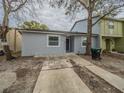 Newly renovated home with a spacious front yard and driveway at 2419 Rio Pinar Lakes Blvd, Orlando, FL 32822