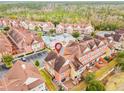 Wide aerial view of the townhome community and surrounding area at 2634 Sunrise Shores Dr, Kissimmee, FL 34747