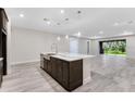 Open-concept kitchen island with quartz countertop and stainless steel sink at 2959 Arranmore Dr, Ormond Beach, FL 32174