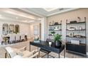 Elegant dining room features a large table, neutral tones, and modern decor at 2971 Arranmore Dr, Ormond Beach, FL 32174
