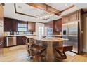 Modern kitchen with stainless steel appliances, a large island, and custom cabinetry at 832 N Summerlin Ave, Orlando, FL 32803