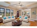 Bright living room featuring hardwood floors, neutral tones, and stylish furnishings for comfortable living at 832 N Summerlin Ave, Orlando, FL 32803