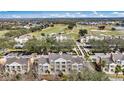 Aerial perspective showcasing expansive community and golf course at 1310 Seven Eagles Ct # 301, Reunion, FL 34747