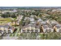 Aerial view of the community, highlighting its layout and proximity to a golf course at 1310 Seven Eagles Ct # 301, Reunion, FL 34747