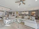 Spacious living room with sectional sofa and large windows at 1402 Lisbon Ct, Davenport, FL 33896