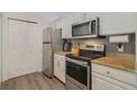 Stainless steel appliances and granite countertops at 142 Southern Pecan Cir # 207, Winter Garden, FL 34787