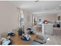 Open concept dining area with views into the kitchen and living room at 1672 Hummingbird Rd, Winter Haven, FL 33884