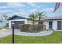 Updated home exterior with modern design, landscaping, and a welcoming walkway at 2932 Carriage Dr, Daytona Beach, FL 32119