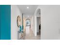 Bright and spacious entryway with tile floors and a glass-top table at 316 Corso Loop, Winter Haven, FL 33884