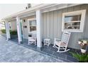 Front porch with rocking chairs and plants at 326 Benton St, Orlando, FL 32839