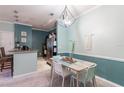 Dining area with table and chairs, adjacent to kitchen at 3583 Conroy Rd # 1135, Orlando, FL 32839