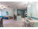 Open dining area with light paint and modern light fixture at 3583 Conroy Rd # 1135, Orlando, FL 32839